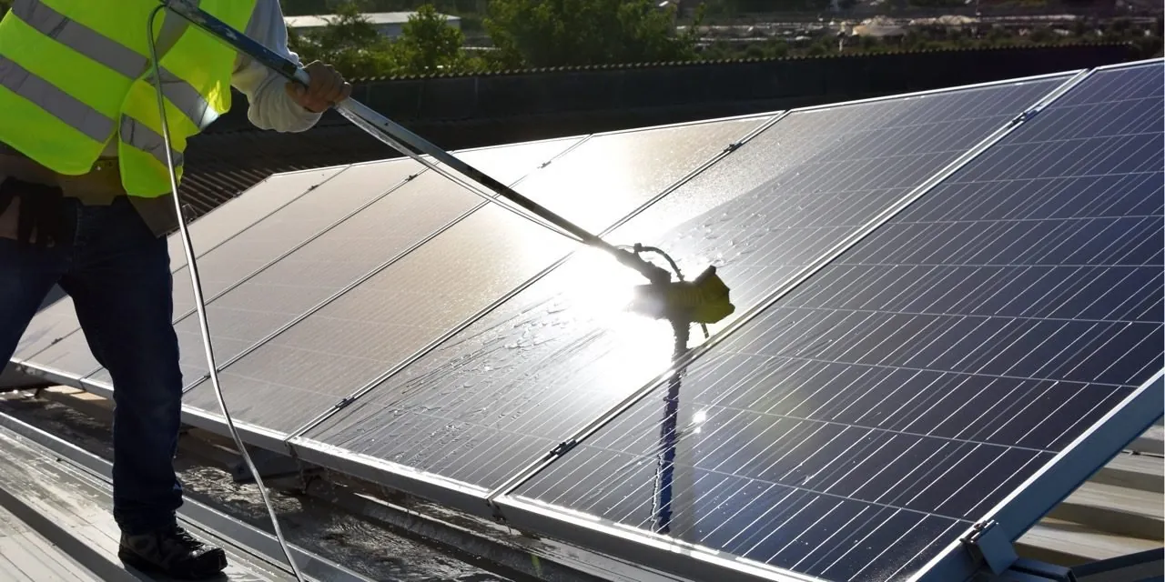 Solar panel cleaning on a Dubai rooftop